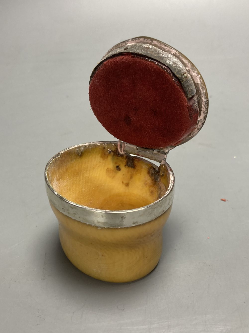 A 19th century white metal mounted horn snuff mull, height 48mm, (a.f.).
